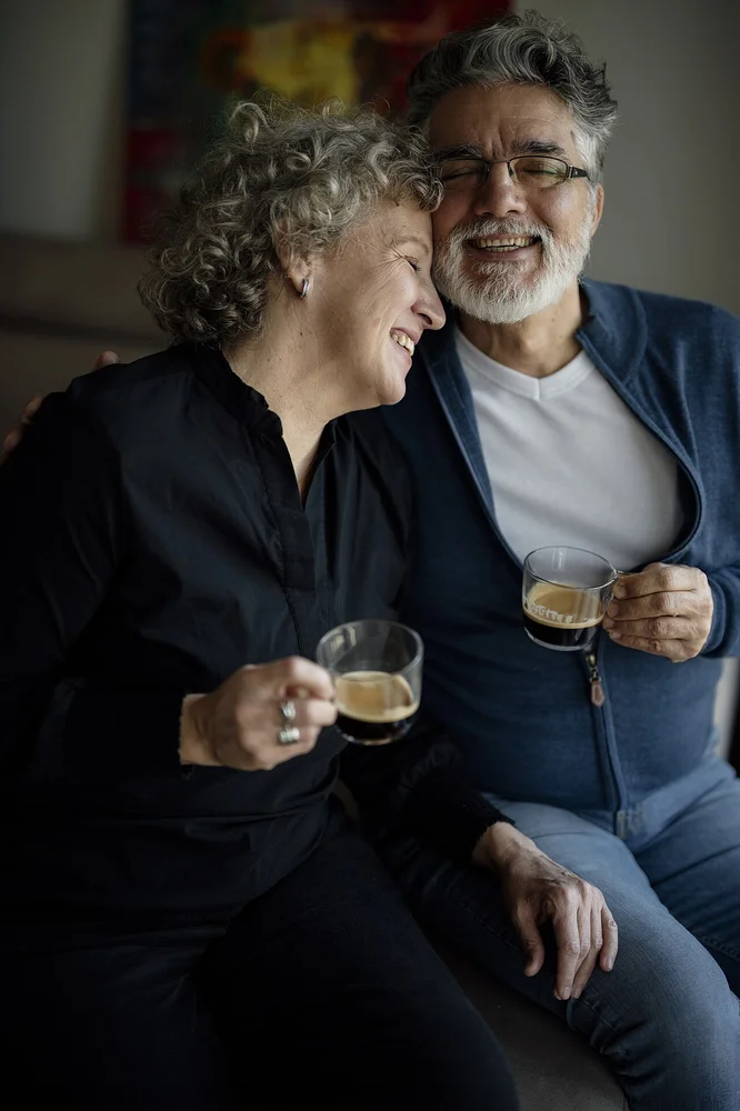 happy facial expression photo — Couple enjoys coffee together at home