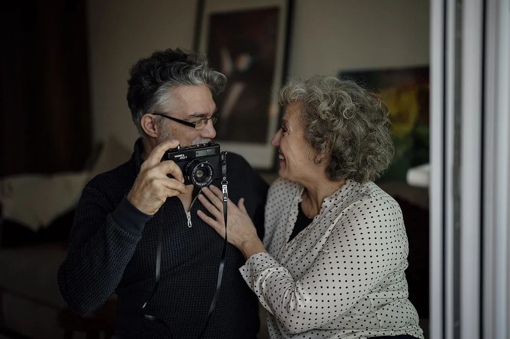 happy facial expression photo — Couple enjoys time together while taking pictures