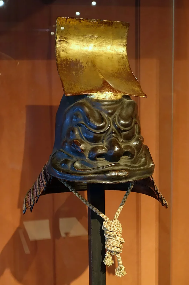 angry facial expression photo — Kawari kabuto (elaborately shaped helmet) symbolizing the cliffs of Ichinotani, 